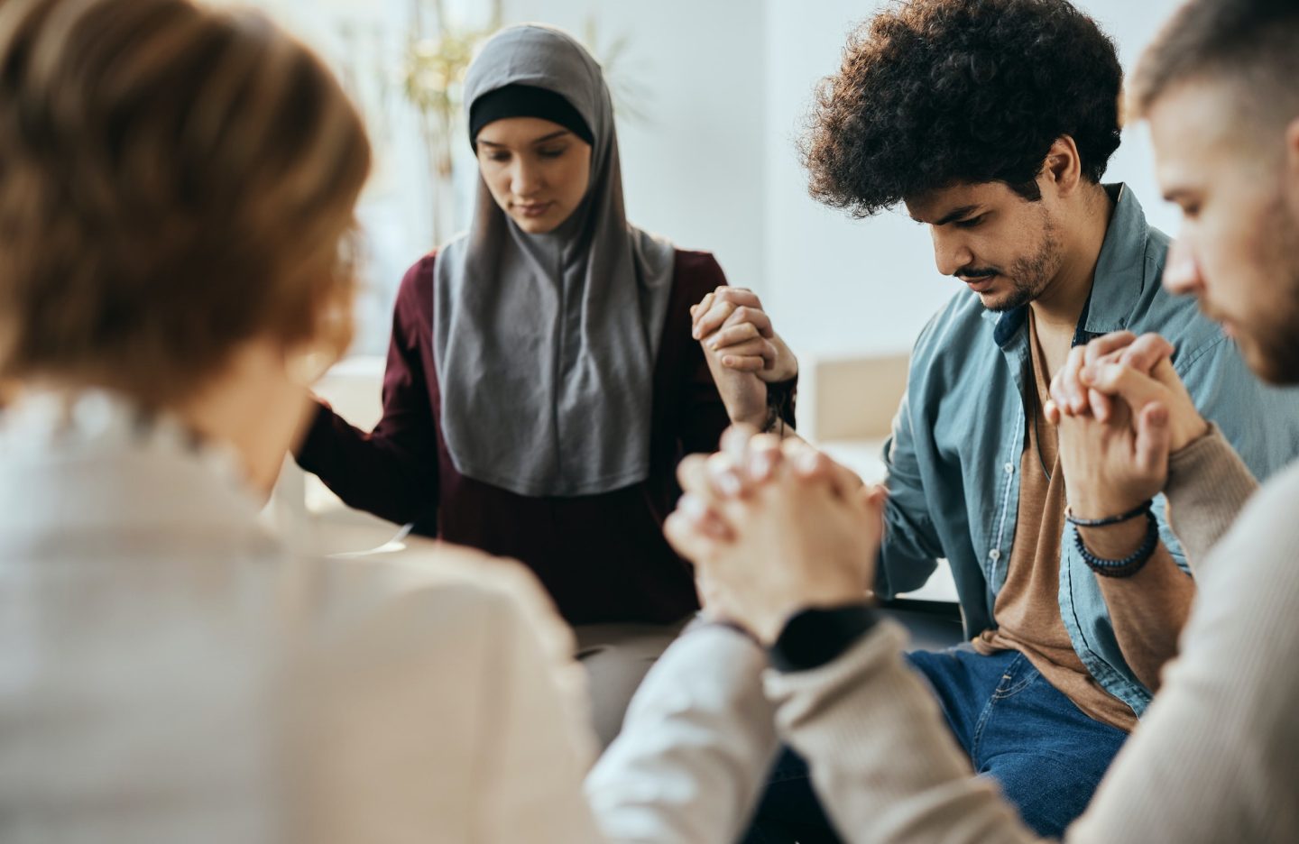 multi-ethnic-attenders-of-group-therapy-holding-hands-during-counseling-at-mental-health-center-.jpg multi-ethnic-attenders-of-group-therapy-holding-hands-during-counseling-at-mental-health-center-.jpg